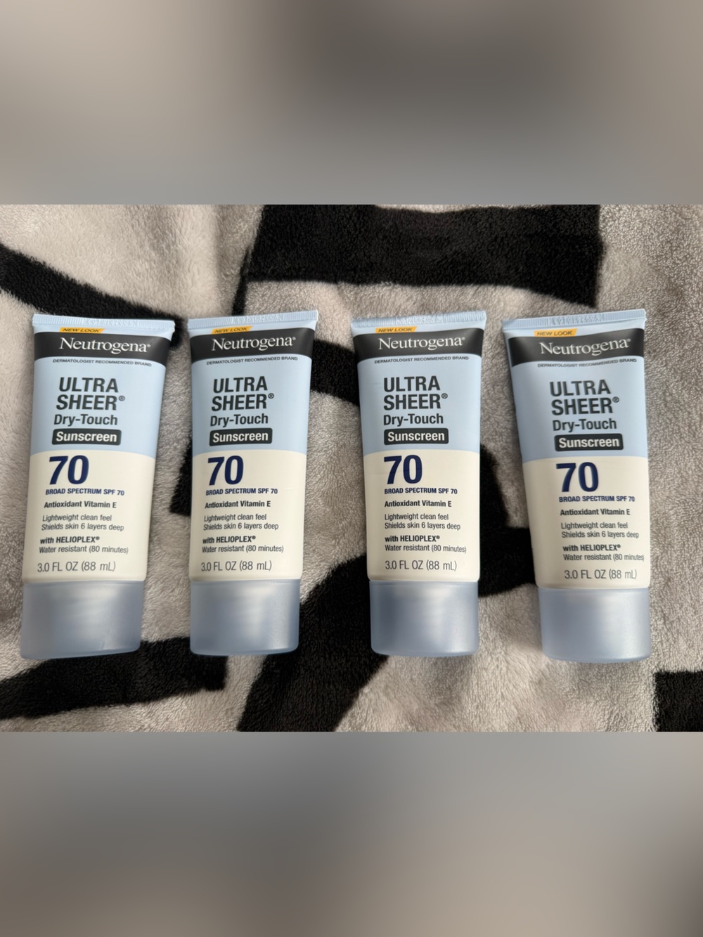 Neutrogena Ultra Sheer Dry-Touch SPF 70 Sunscreen - Light Blue and White Tubes